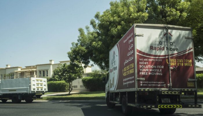 Image of a movers and packers truck which is moving stuff as it shows the office relocation in Dubai.
